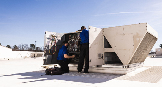 technicians servicing commercial HVAC and refrigeration