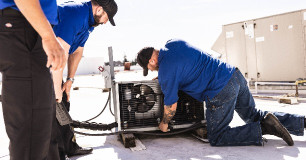 DOC technicians servicing equipment