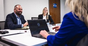 team members working together in conference room