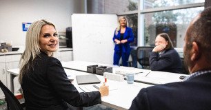 account management professionals collaborating in conference room