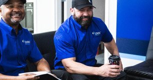 technicians smiling for picture at training center