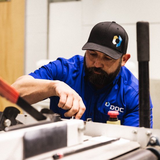 DOC technician servicing equipment