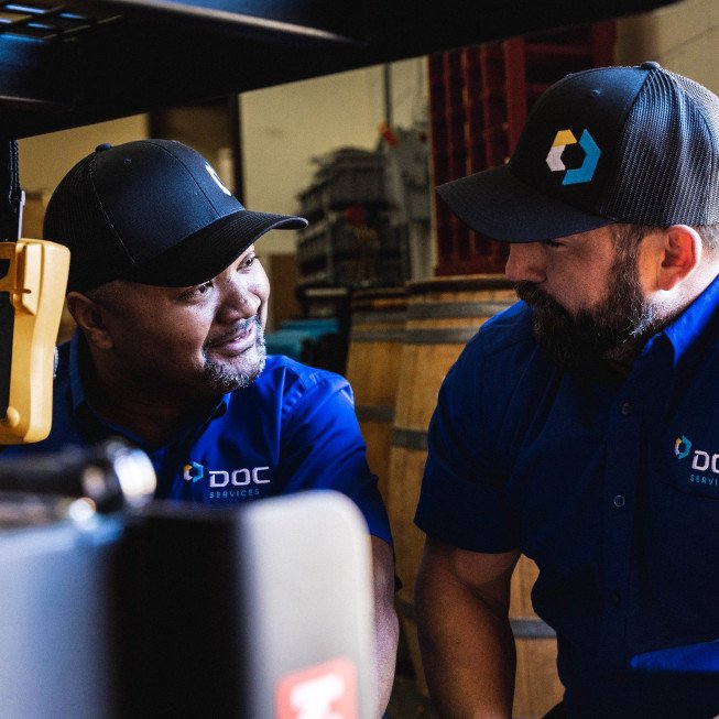 technicians smiling while working together