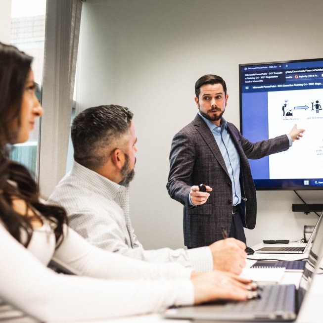 team member presenting on TV