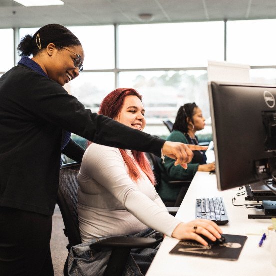 DOC employees working together in office