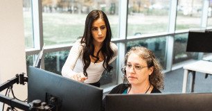 two employees working together to streamline dispatch processes