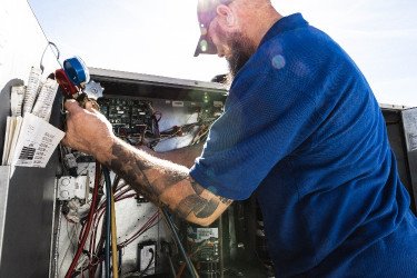 technician performing preventative maintenance