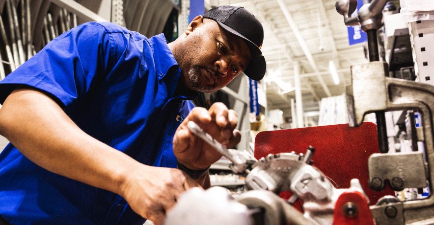 DOC Services technician working on equipment